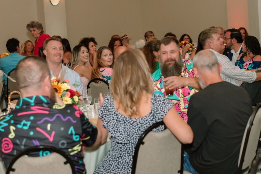 a large group of people sitting at tables