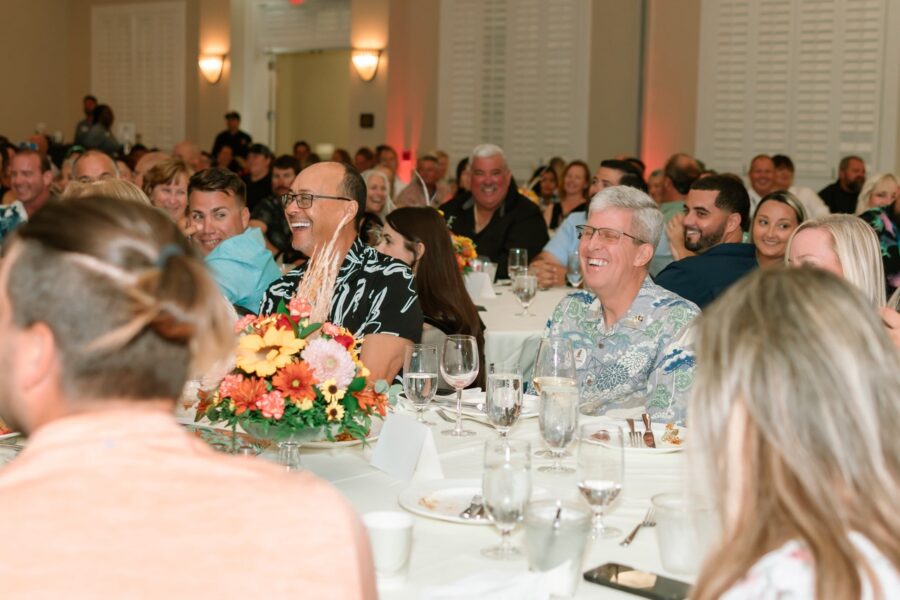 a large group of people sitting at a table