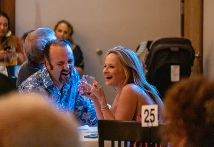 a group of people sitting around a table