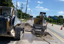 a road construction crew working on a road