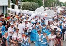 a large group of people walking down a street