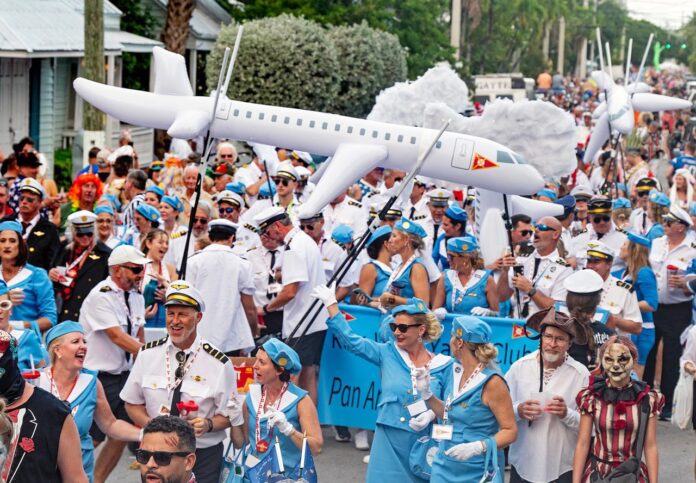 a large group of people walking down a street