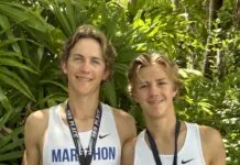 a couple of young men standing next to each other