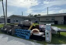 a pile of furniture sitting on the side of a road