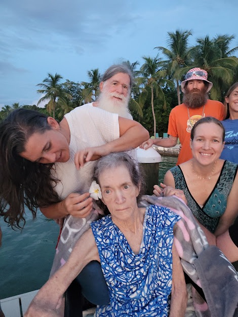 a group of people on a boat posing for a picture