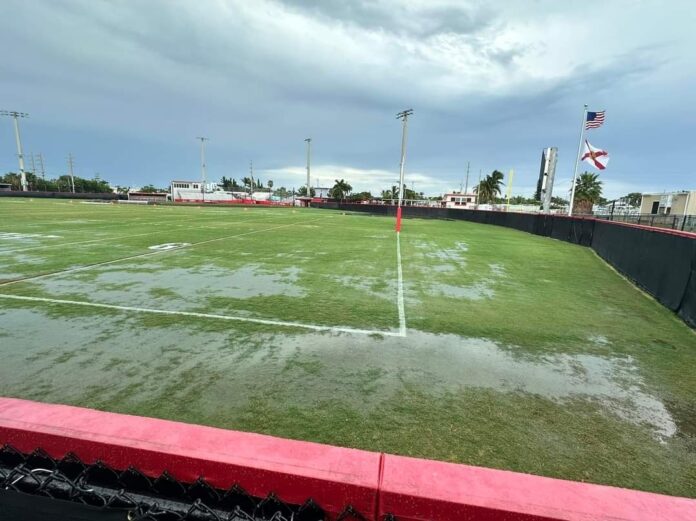 an empty soccer field with a flag on it