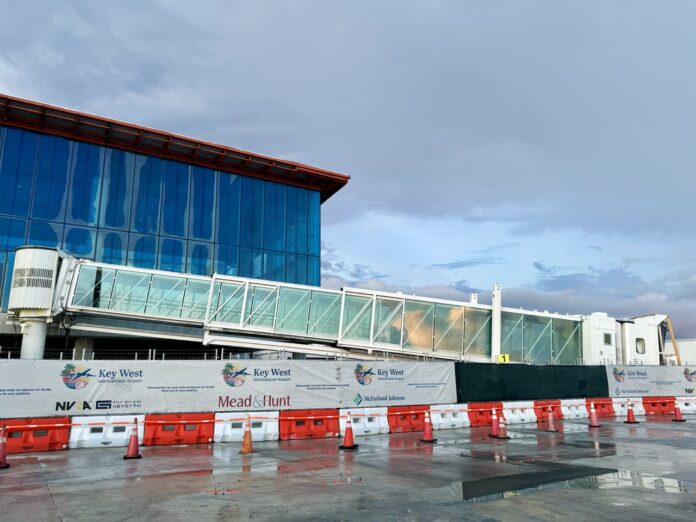 a building under construction with a cloudy sky in the background