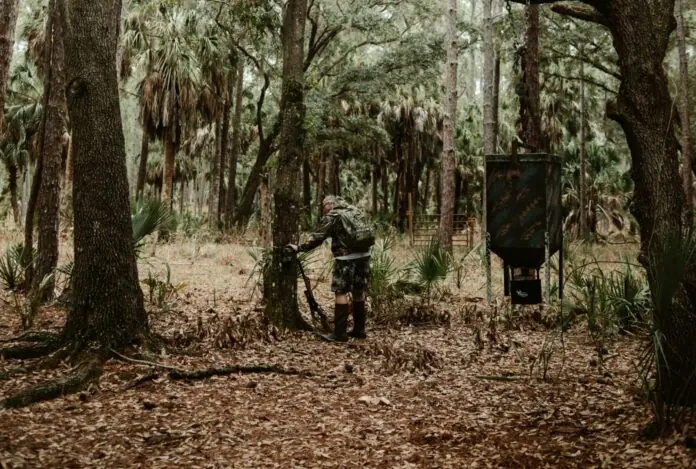 a person riding a bike through a forest