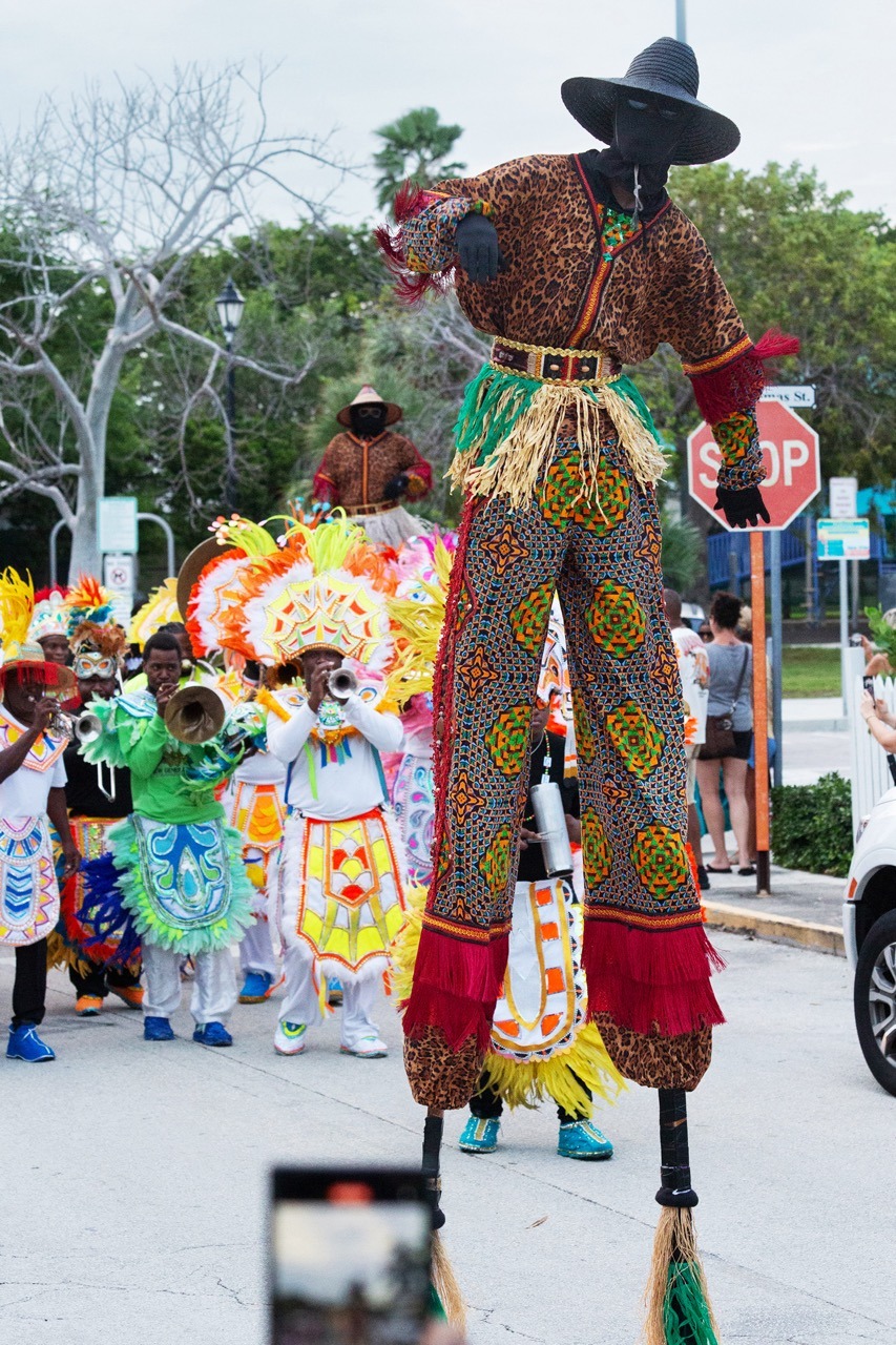 a group of people in costumes on a street