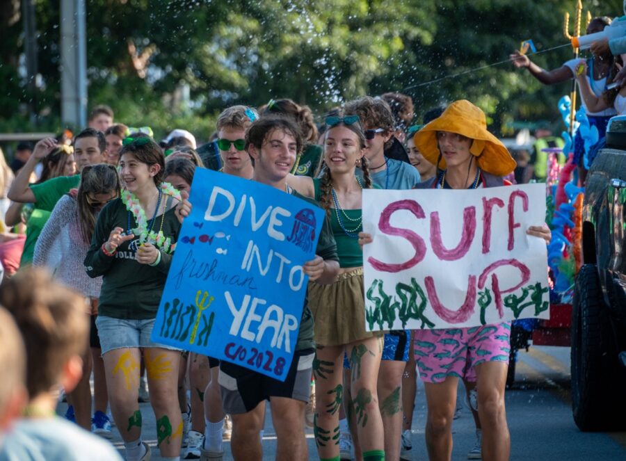 a group of people holding up signs in the street