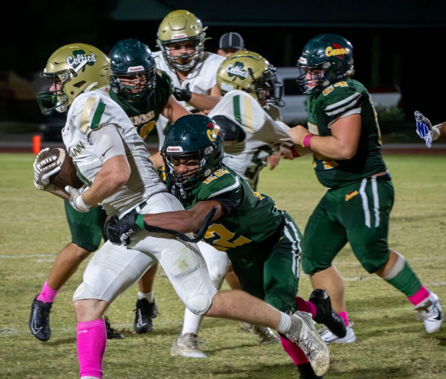 a group of people playing a game of football