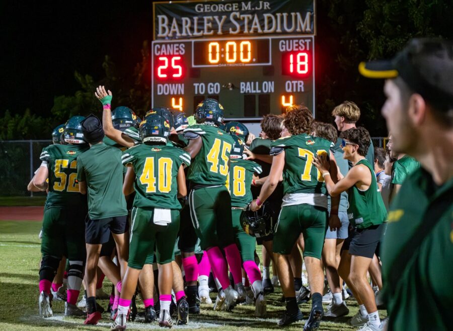 a football team huddles together before a game