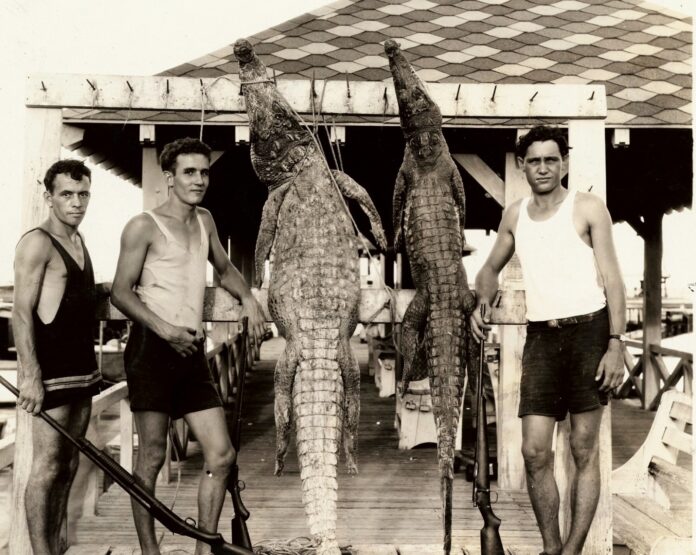 a group of men standing next to each other on a dock