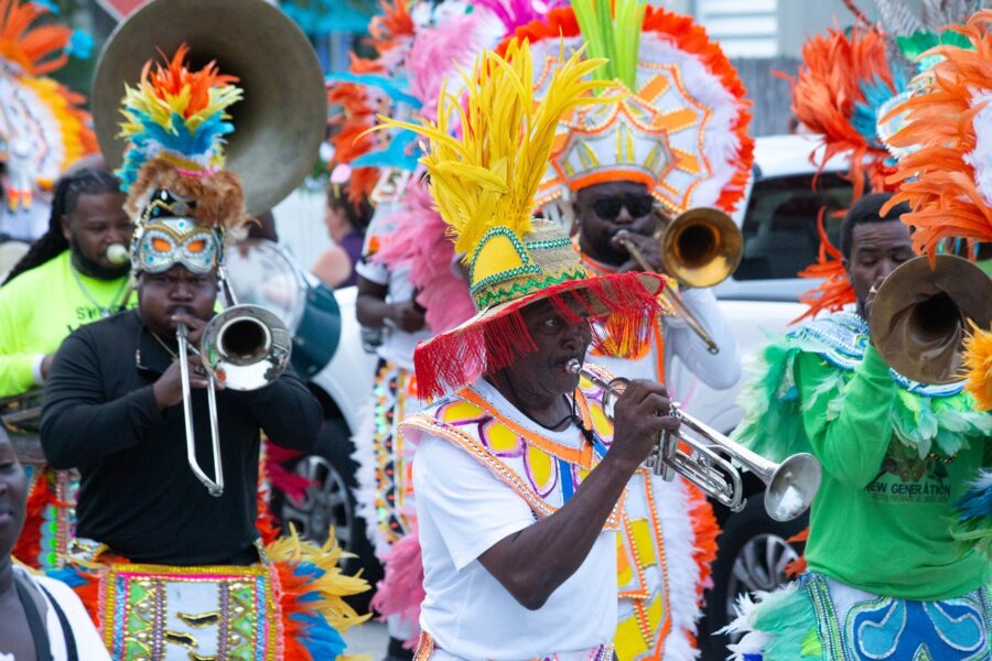 a group of people in colorful costumes playing instruments