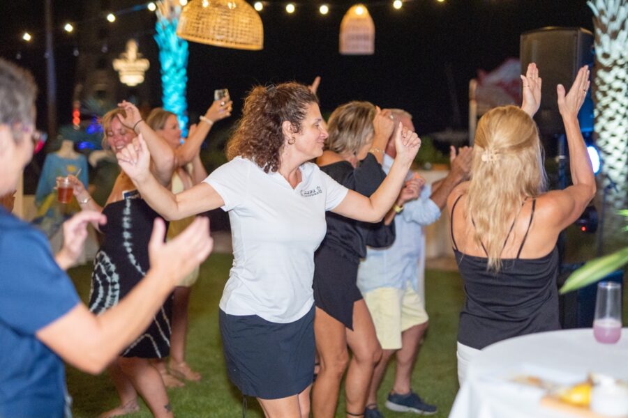 a group of people dancing at a party