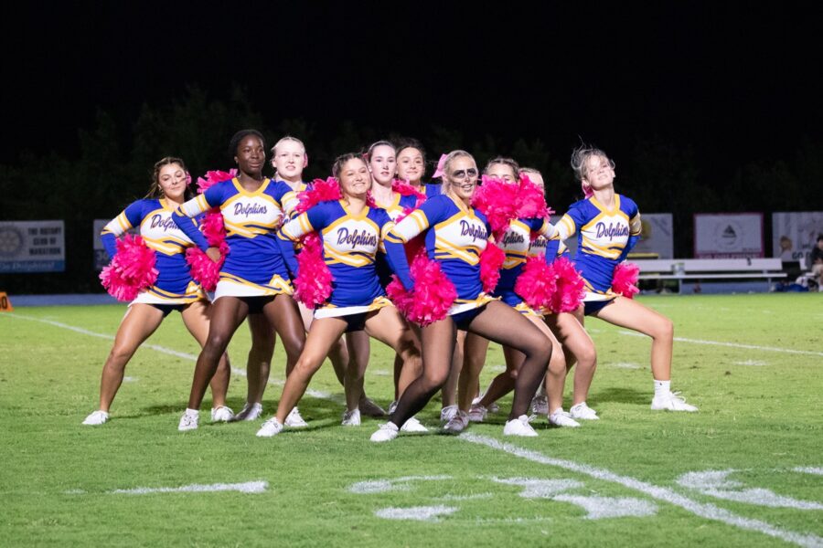 a group of cheerleaders posing for a picture