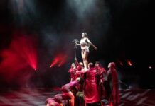 a group of people standing on top of a stage