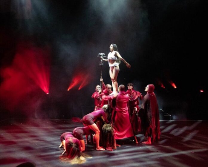 a group of people standing on top of a stage