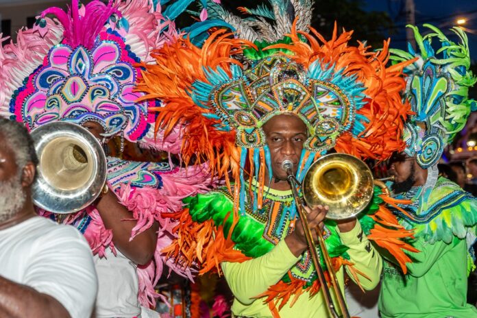 a man in a colorful costume holding a trumpet