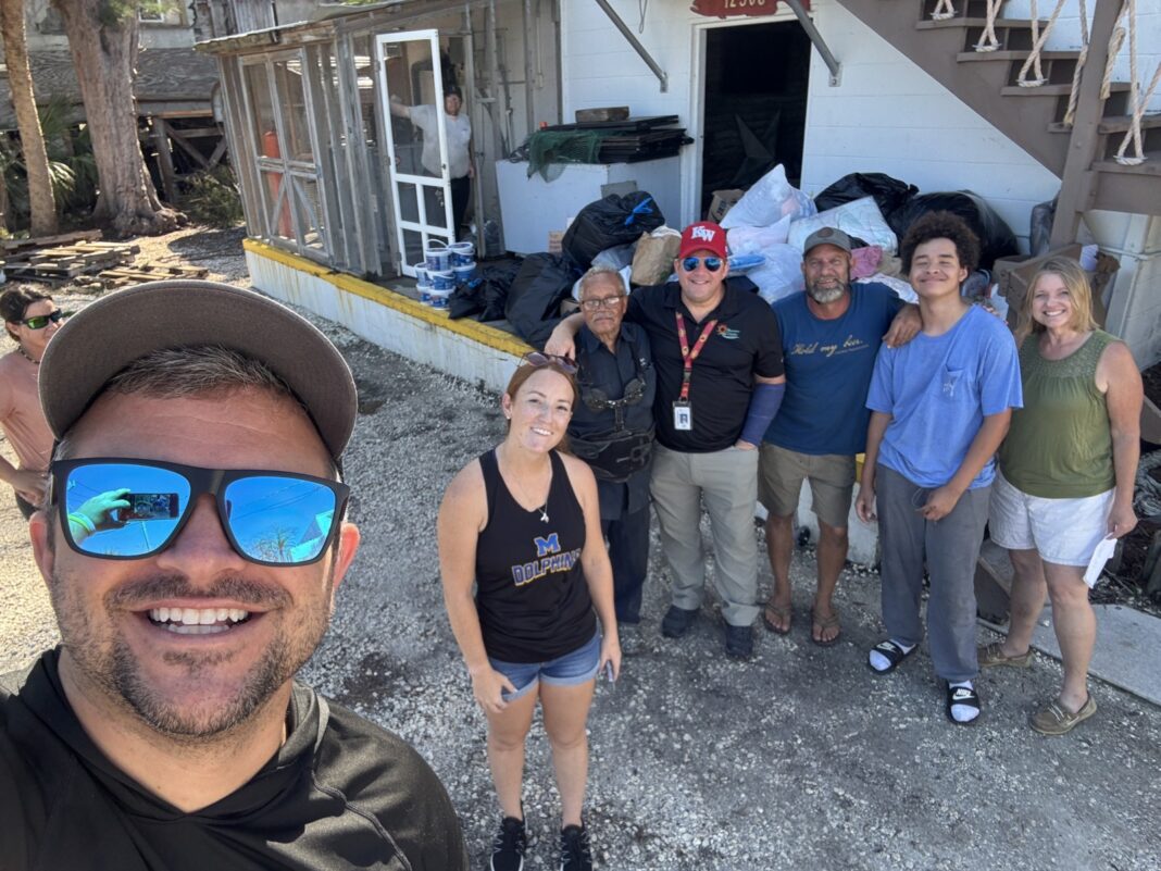 a group of people standing in front of a house