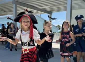 a group of young girls dressed in pirate costumes