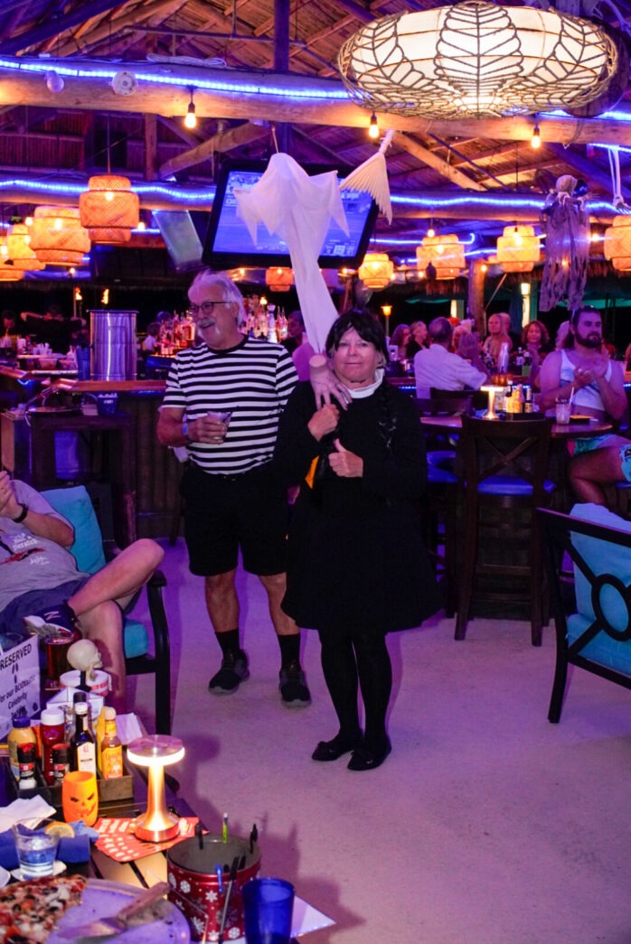 a group of people standing around a bar