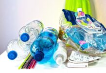 a pile of plastic bottles sitting on top of a table