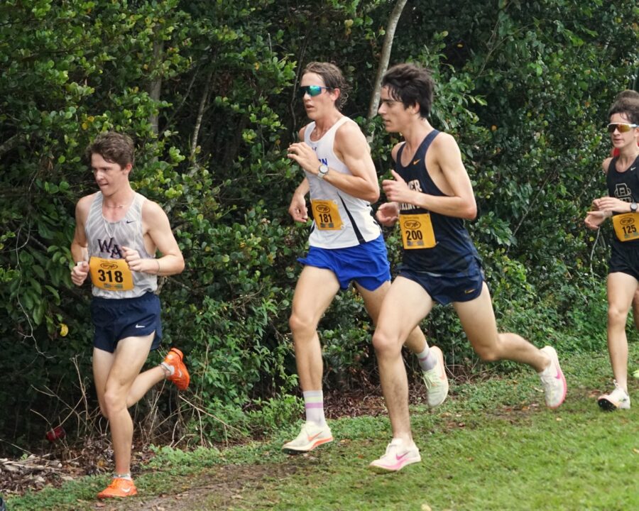 a group of men running in a race