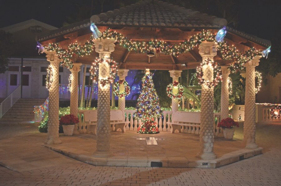 a gazebo decorated with christmas lights and decorations