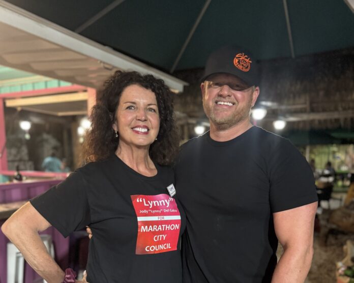 a man and a woman standing under an umbrella