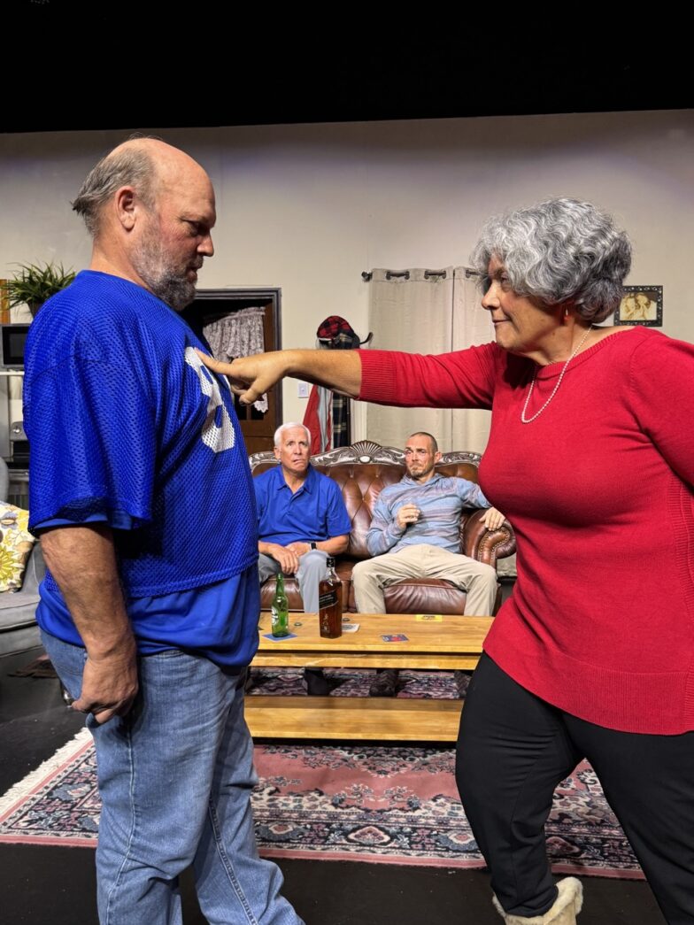 a man and a woman dancing in a living room