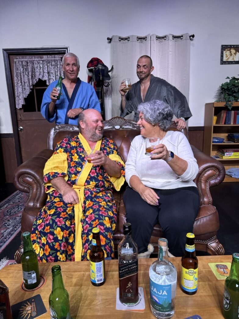 a group of people sitting around a living room table