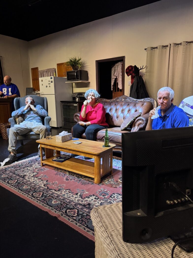 a group of people sitting around a living room