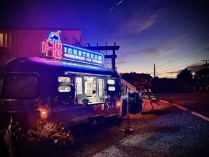 a food truck parked on the side of the road