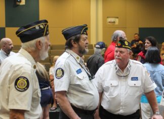 a group of men standing next to each other