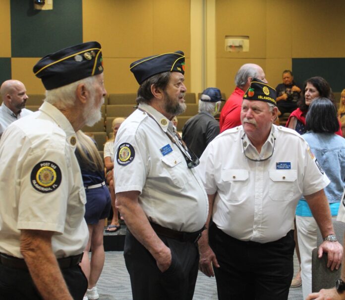 a group of men standing next to each other