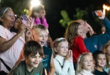 a group of children standing next to each other