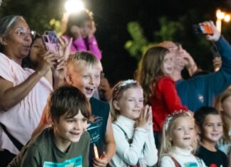 a group of children standing next to each other