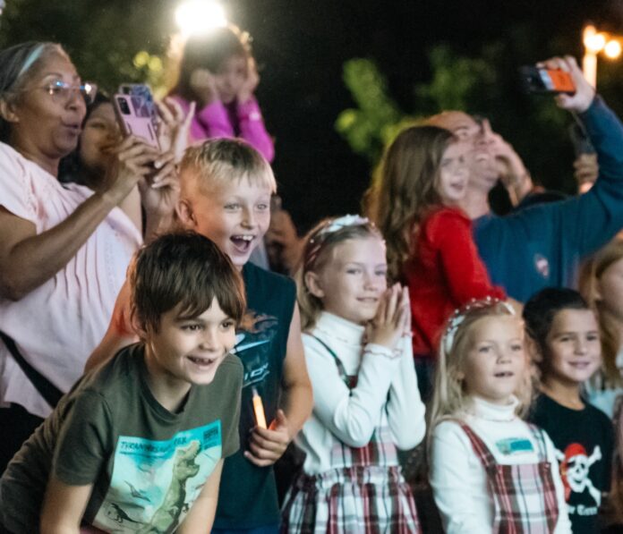 a group of children standing next to each other