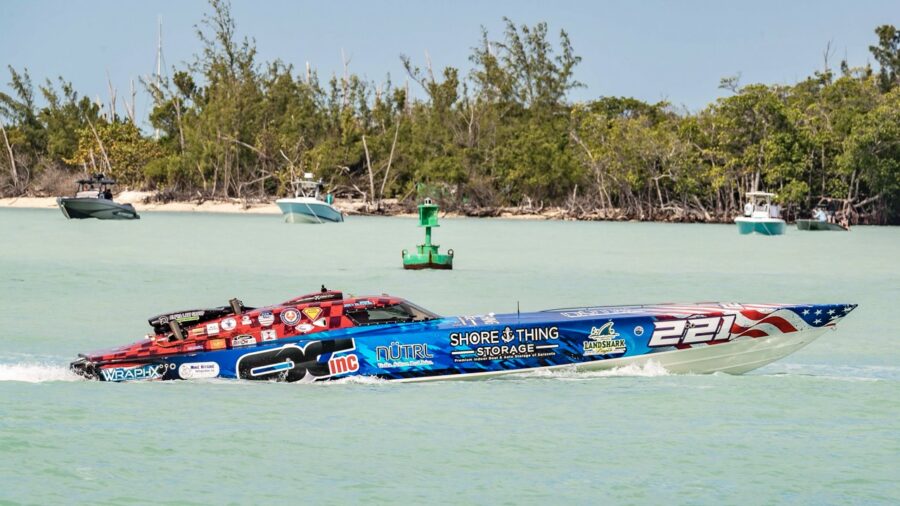 a speed boat in the middle of a body of water