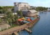 an aerial view of a resort on the water