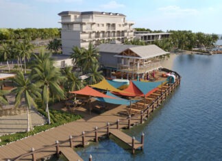 an aerial view of a resort on the water