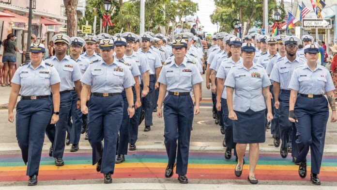 a group of women in uniform walking down a street