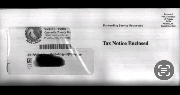 a close up of a tax envelope with a stamp on it