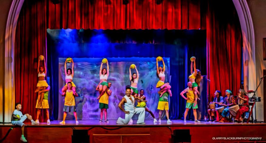 a group of people standing on top of a stage