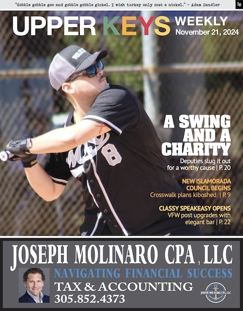 a magazine cover with a baseball player swinging a bat