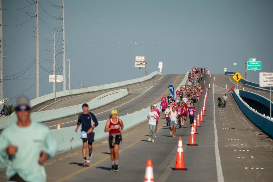 a group of people that are running down a road