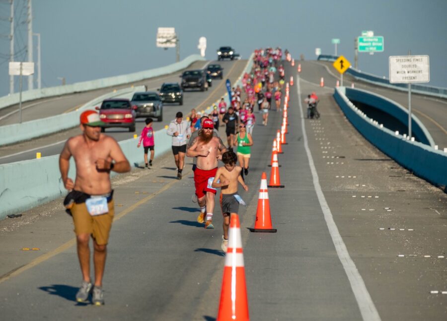 a group of people running on a road