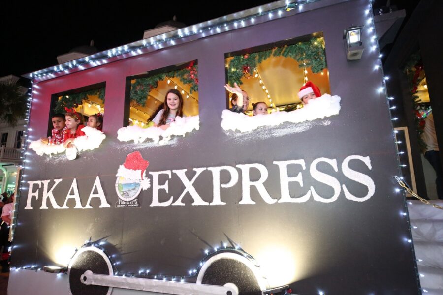 a bus decorated with christmas lights and pictures