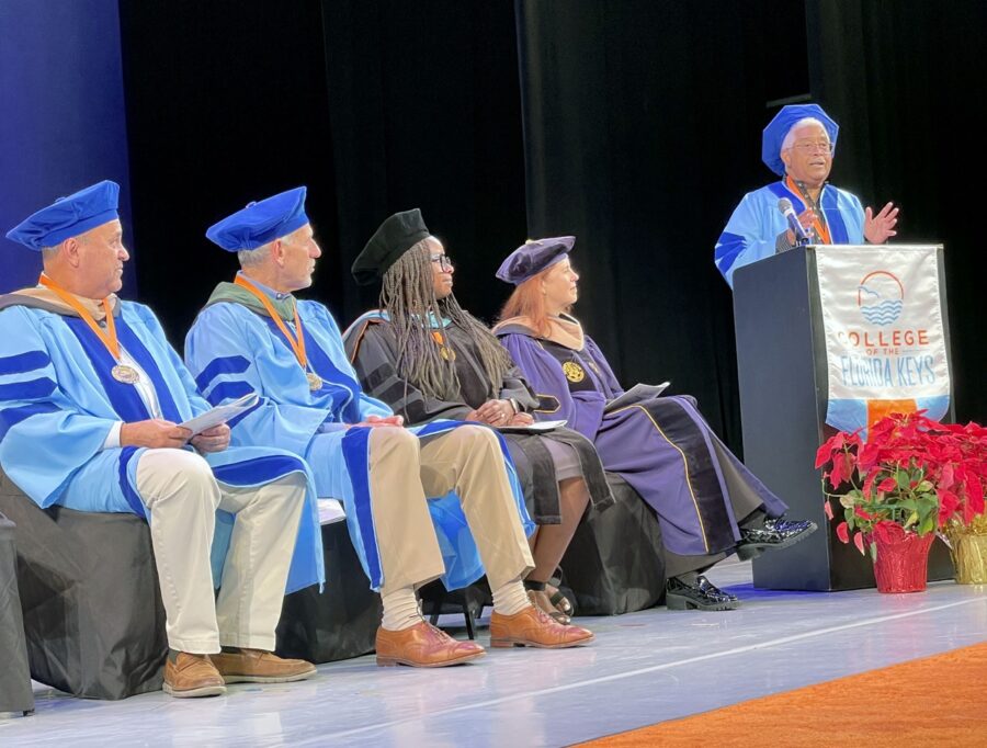 a group of people sitting in front of a podium